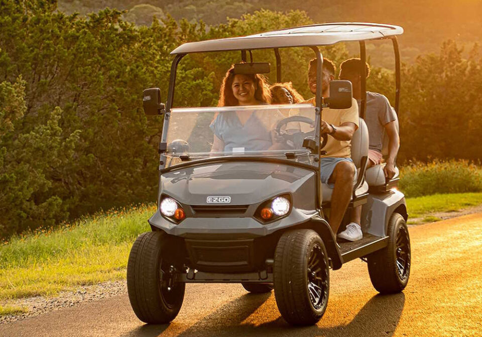 family riding in ezgo cart