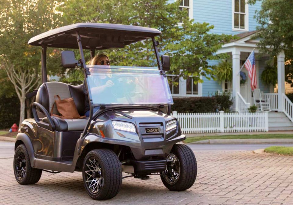 woman driving cart on road